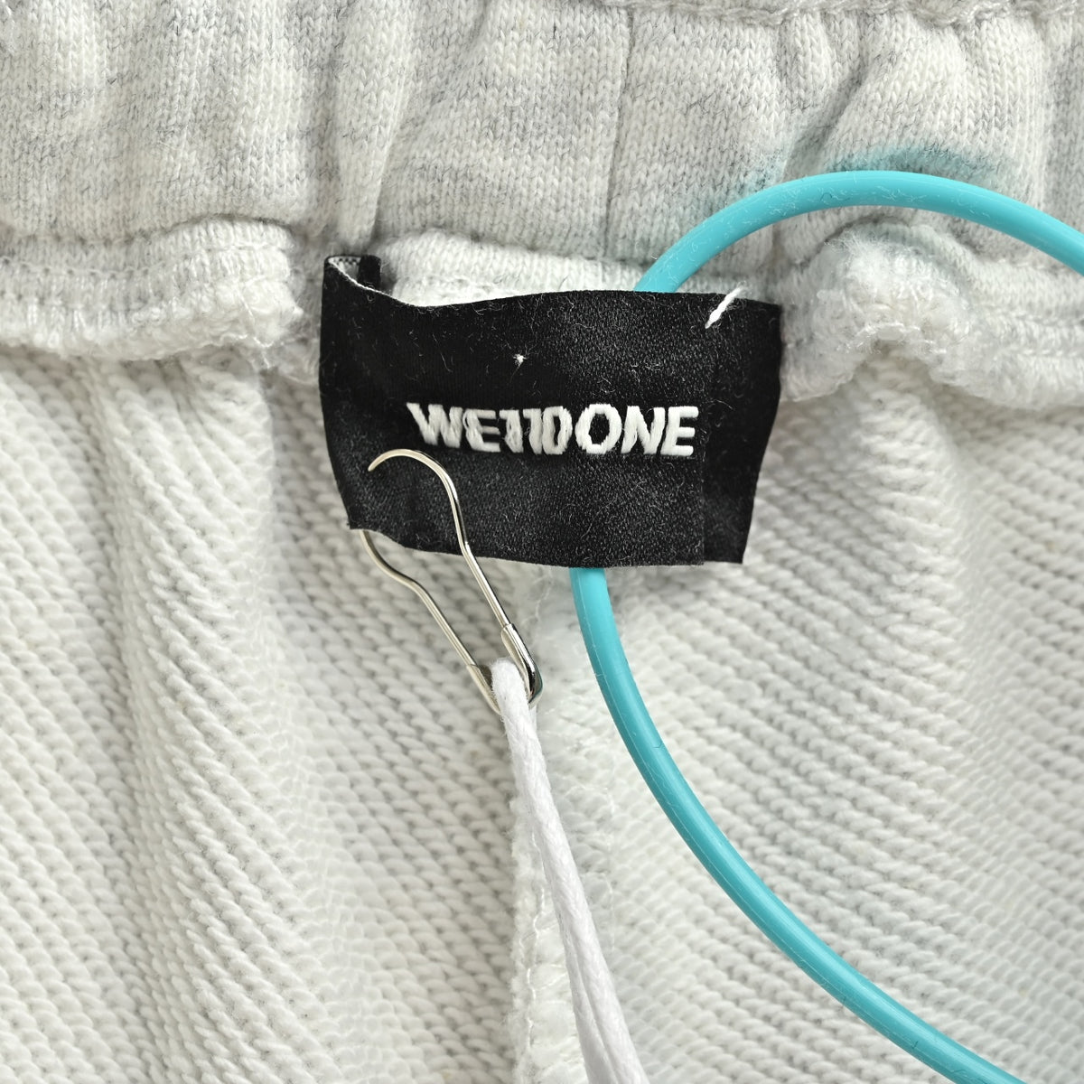 WE11DONE Silicone Logo Drawstring Fleece Shorts — White